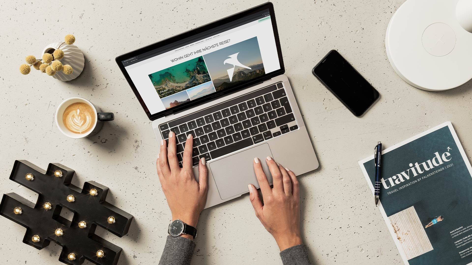 A lady working on a laptop at Falkensteiner Hotels & Residences