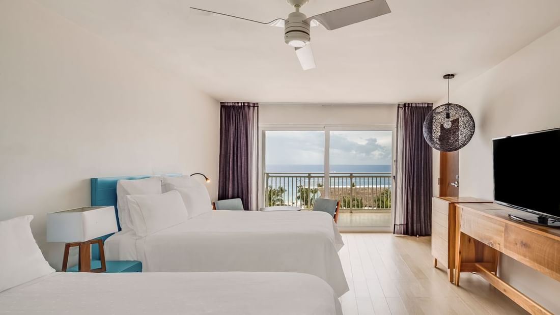 2 Double beds & TV in Deluxe Ocean View Room at FA Cozumel