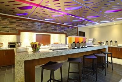 Buffet area with colorful lighting and food stations in MARINN Restaurant at MARINN PLACE Financial District
