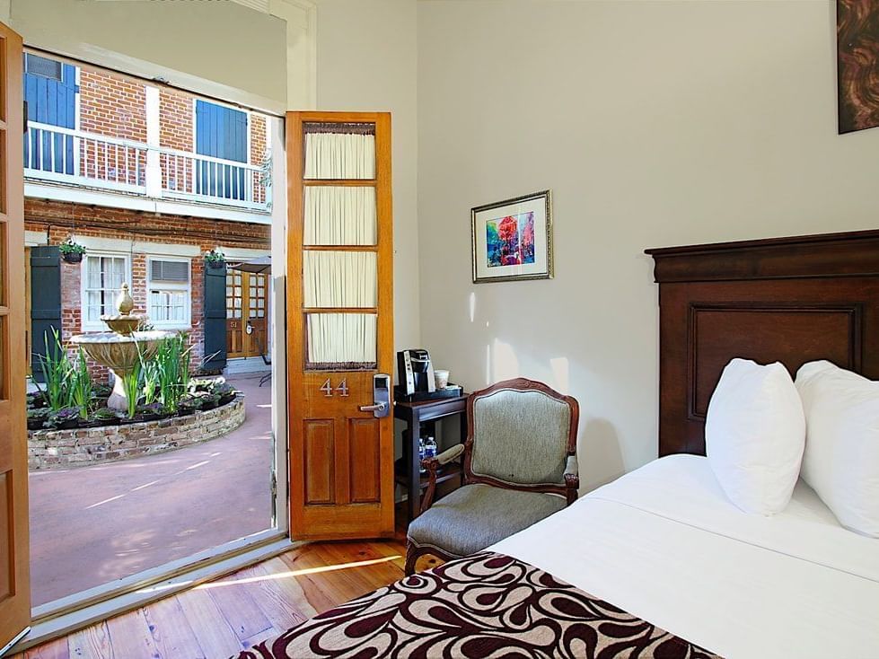 Bed & door, Laveau Guest Room at French Quarter Guesthouses