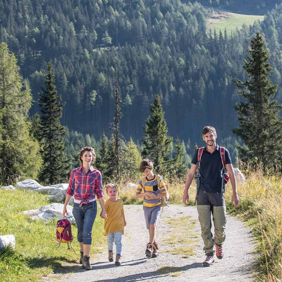 A family walking on a footpath near Falkensteiner Hotels