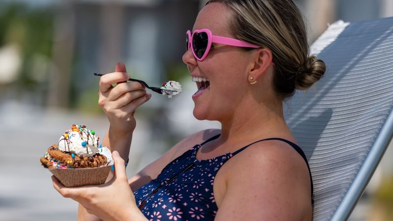 A portrait of the woman eating ice cream at WaterColor Inn