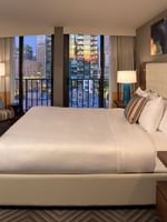 Stylish Evergreen Suite with a king bed, balcony, and city view at Warwick Seattle in Seattle.