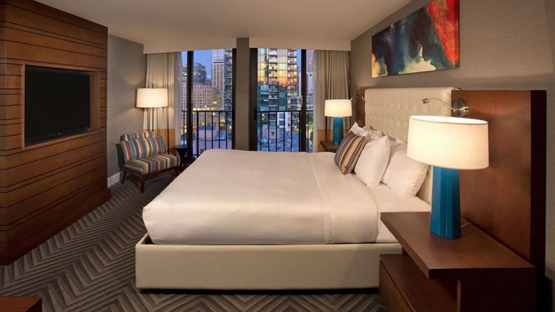 Stylish Evergreen Suite with a king bed, balcony, and city view at Warwick Seattle in Seattle.
