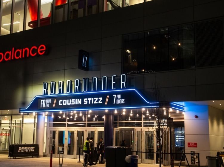 Nighttime exterior of a theater entrance with