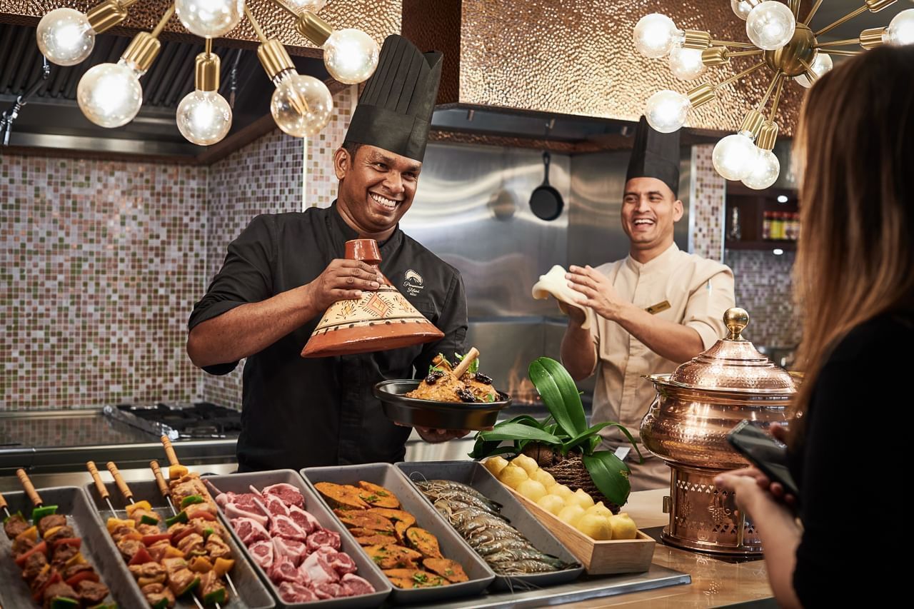 Chefs presenting meat dishes in The Stage's Iftar buffet at Paramount Hotel Dubai