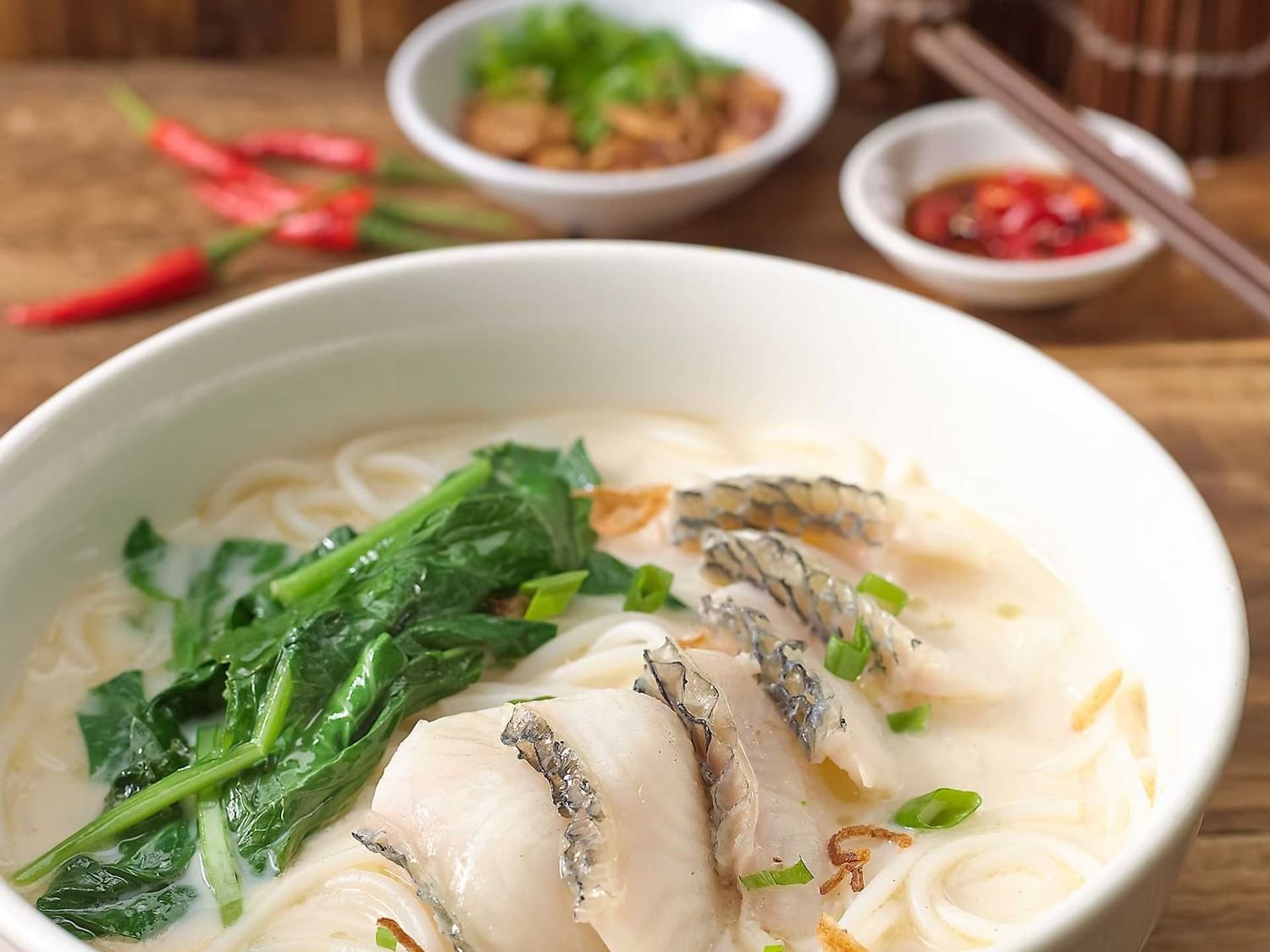 Gogi-guksu served on wooden table in White Rose Café at York Hotel Singapore