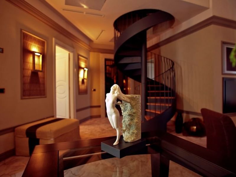 Spiral staircase, statue & lamps in Presidential Suite at Grand Visconti Palace