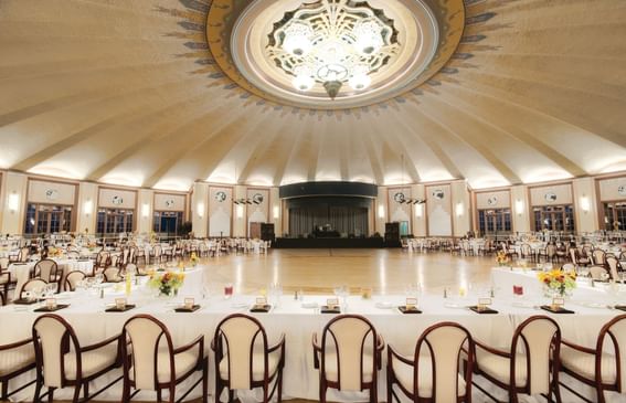 Tables arranged for an event in a Hall at Catalina Island Company