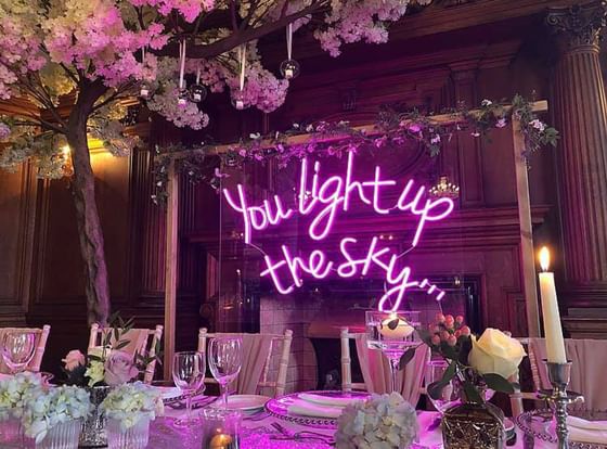 Arranged table set-up & neon sign in a wedding ceremony, wedding venues in York at The Milner York