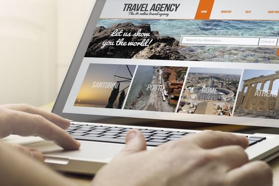 Travel agency website on a laptop at Jamaica Pegasus Hotel
