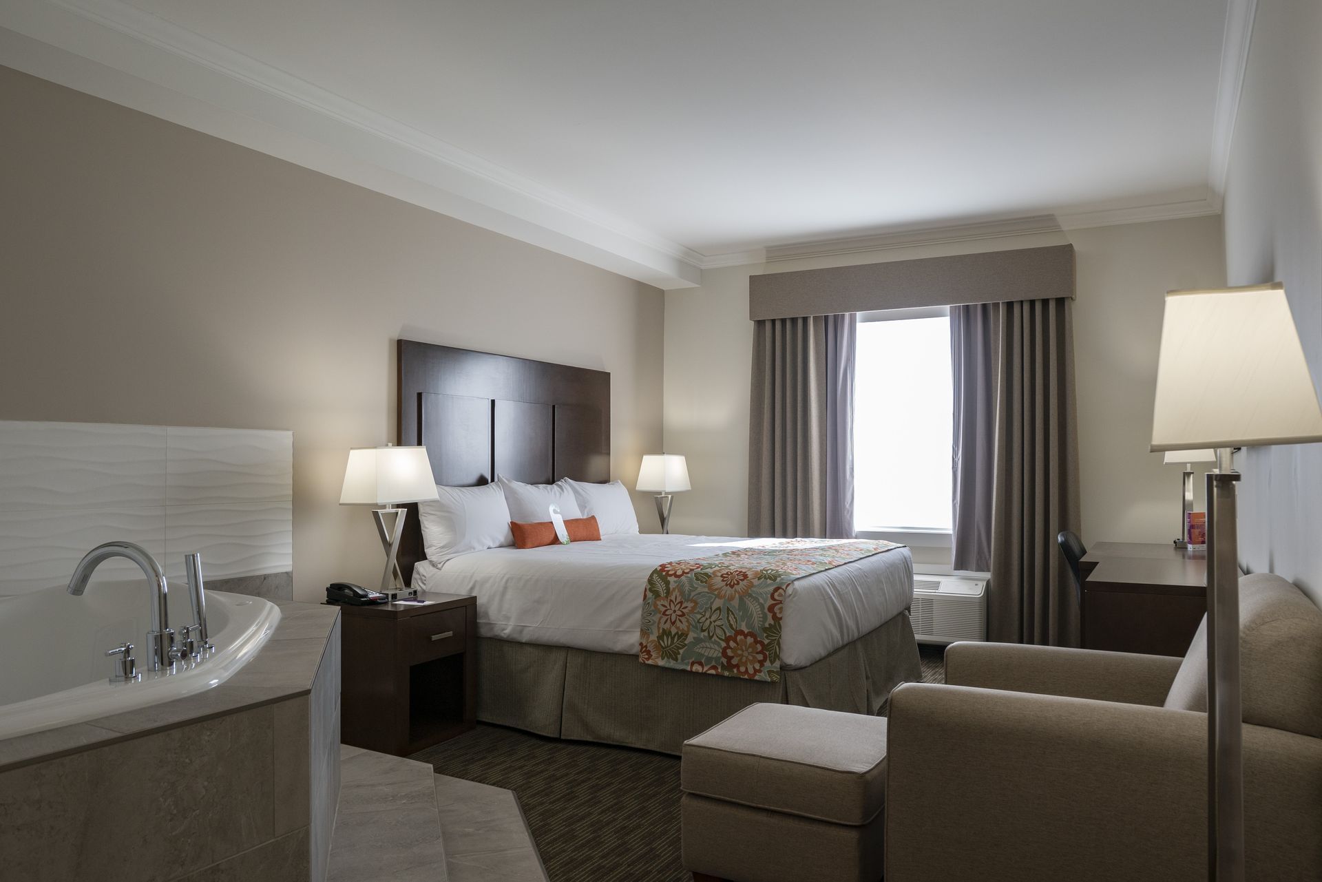 Bed and tub in hotel suite