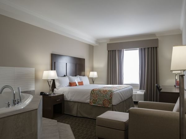Bed and tub in hotel suite