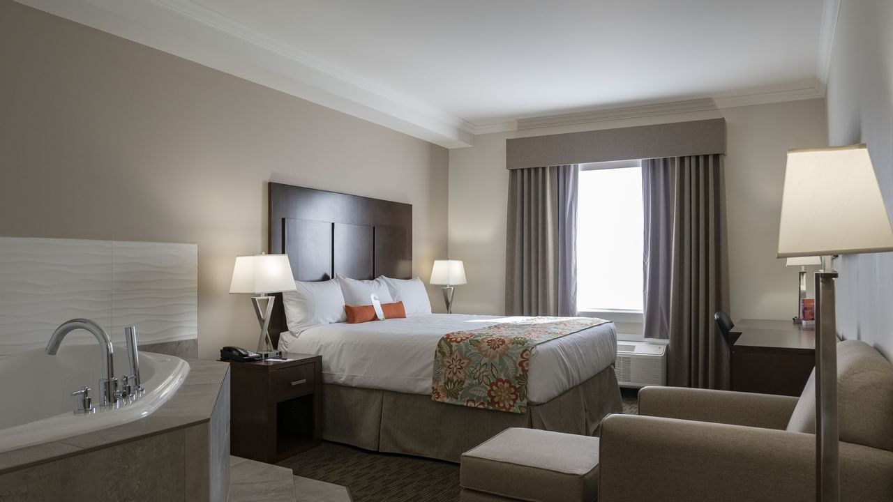 Bed and tub in hotel suite