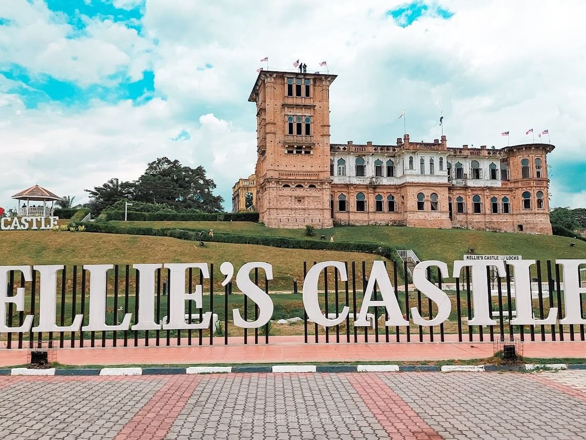 Daytime view of Kellie's Castle sign with Castle near Cititel Express Ipoh