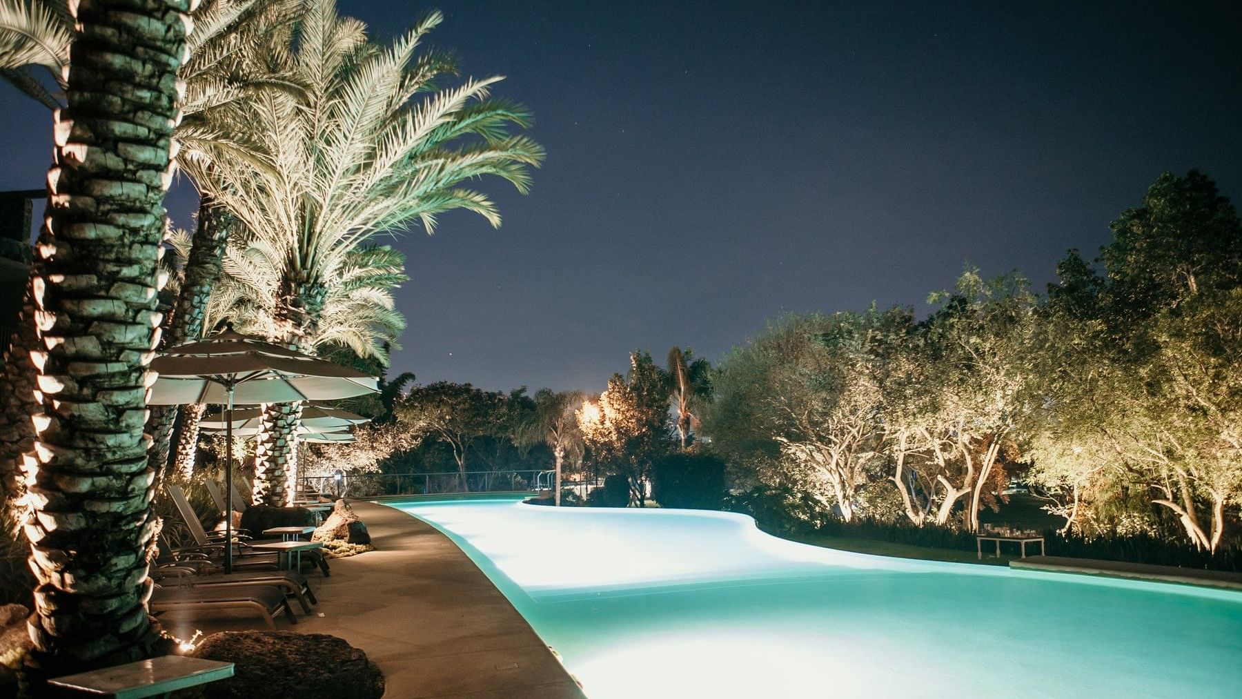 Night view of pool at Huayacan Cuernavaca Curamoria Collection