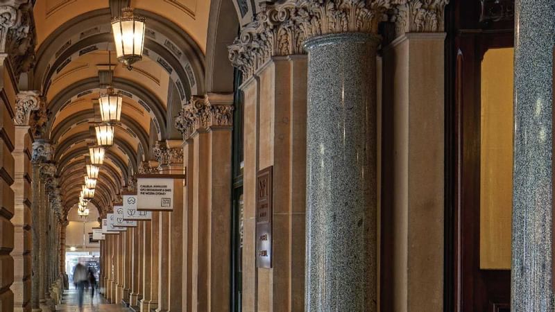 A building corridor with lamps near Fullerton Group