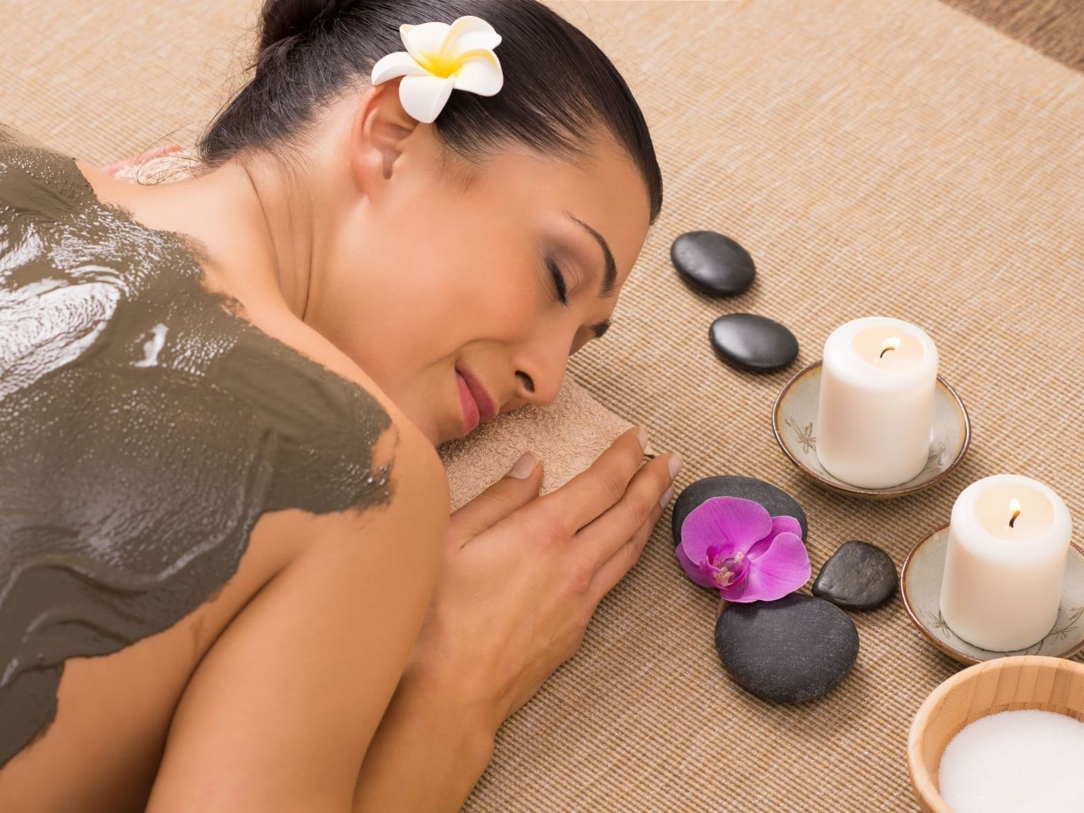 A lady getting a mud treatment in a spa at Ana Hotels Europa