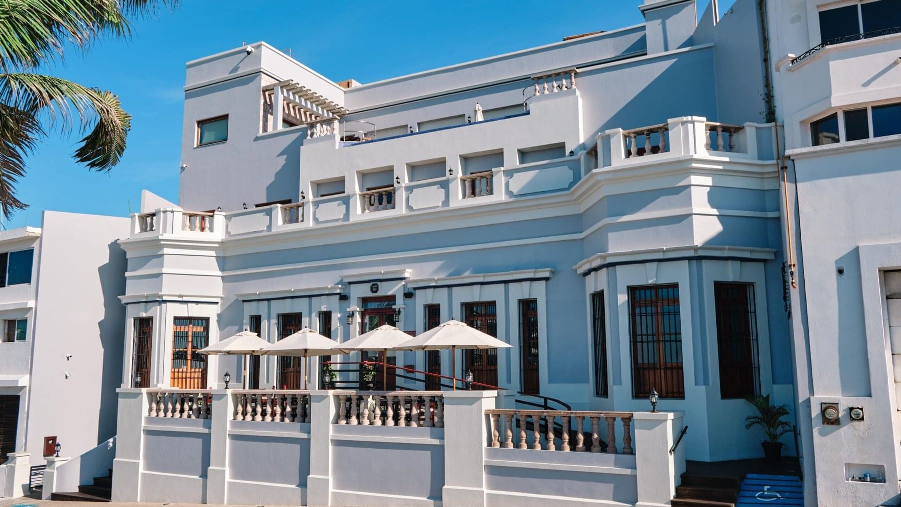 Exterior view of Curamoria Collection front entrance, and street-side presence