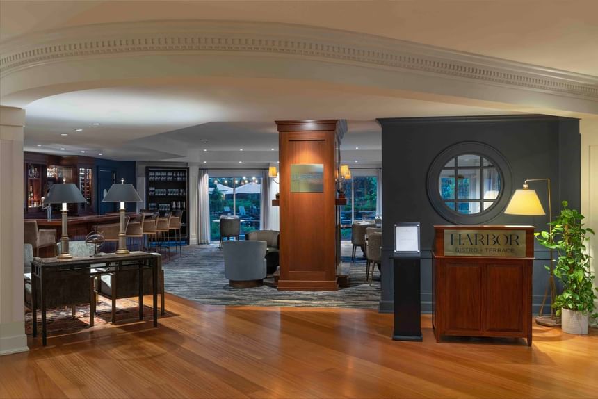 Bar counter by the dining area in Harbor Bistro with wooden floors at Portland Harbor Hotel