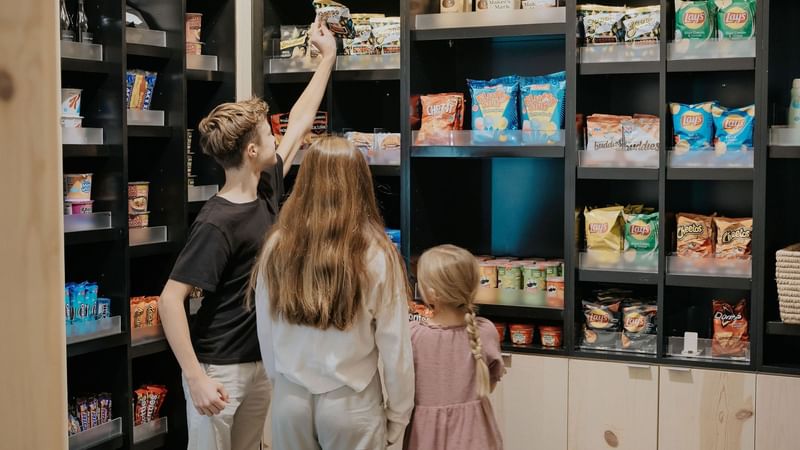 Kids looking at snacks available in the Market at The Lodge 30A
