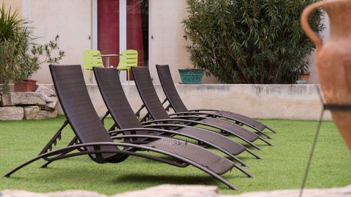 Sunbeds by the garden at Hotel Le Village Provencal