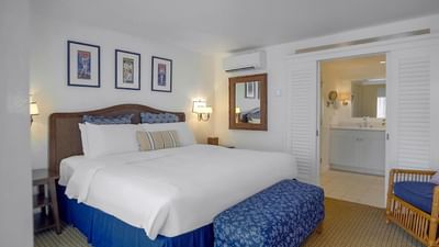 Mirror and ottoman by the bed in Premier King Room at Pavilion Hotel Catalina Island
