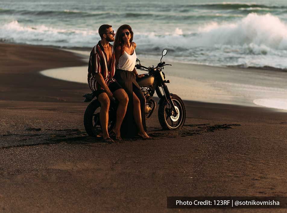 couple on the motorbike spending time on the beach - Grand Lexis PD