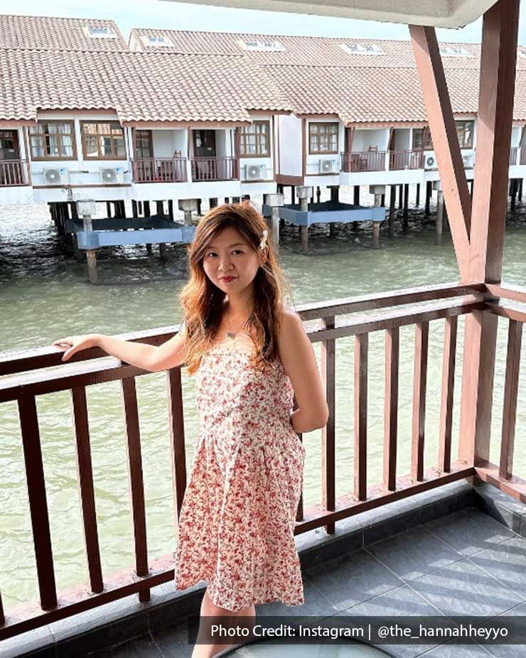 a woman wearing a pink dress with the seaview behind her - Lexis PD