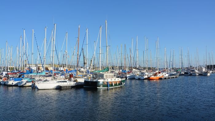 Boats stationing in Saint-malo port near The Originals Hotels