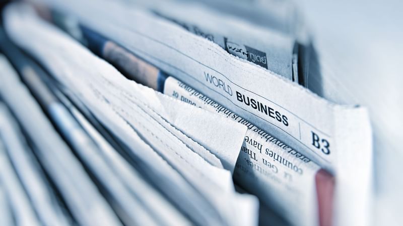 Close-up on newspapers on shelf at Fullerton Group