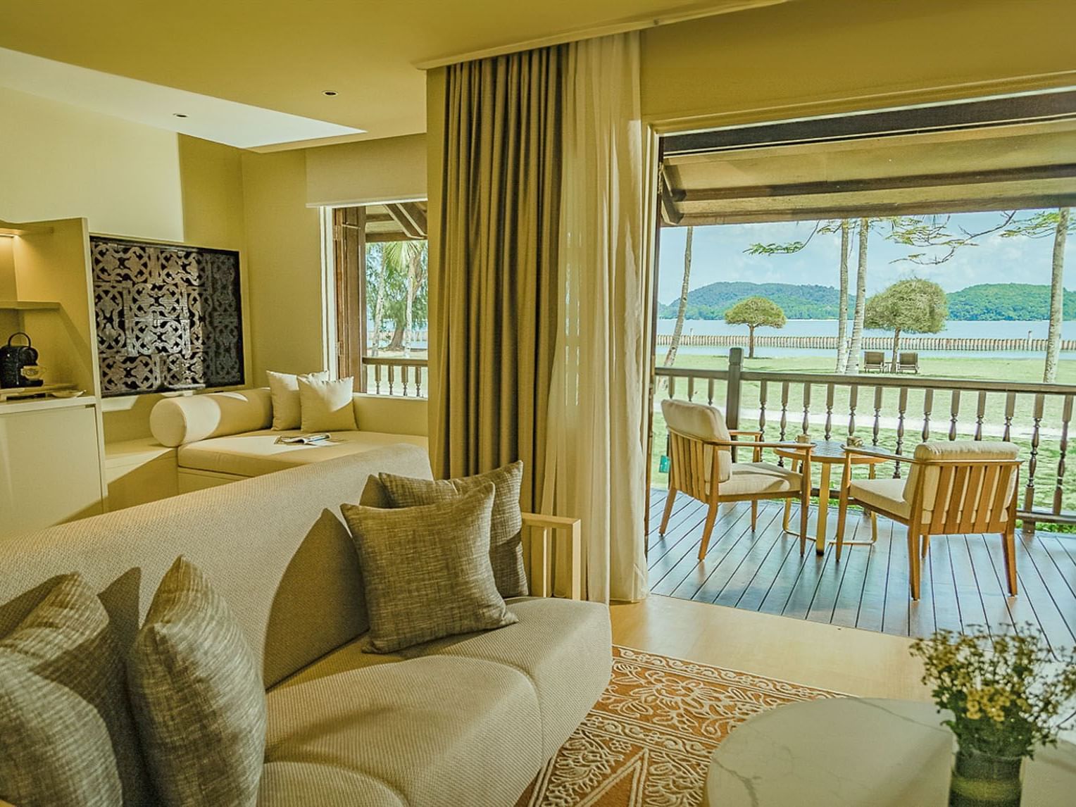 Sofa & balcony in Pelangi Suite at Pelangi Beach Resort & Spa