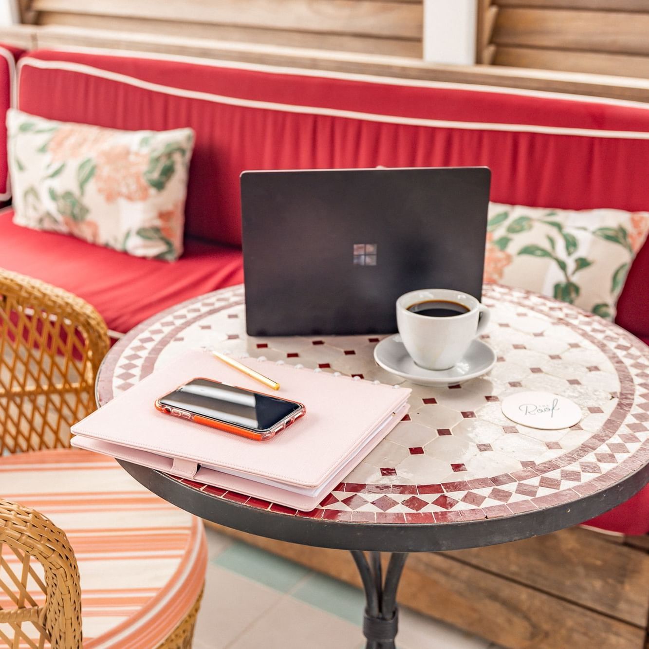 Laptop & coffee on a table in the lounge at Esme Miami Beach