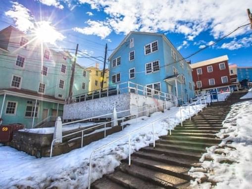 Snowy hillside with colorful houses at Sewell in Chile, a UNESCO World Heritage city.