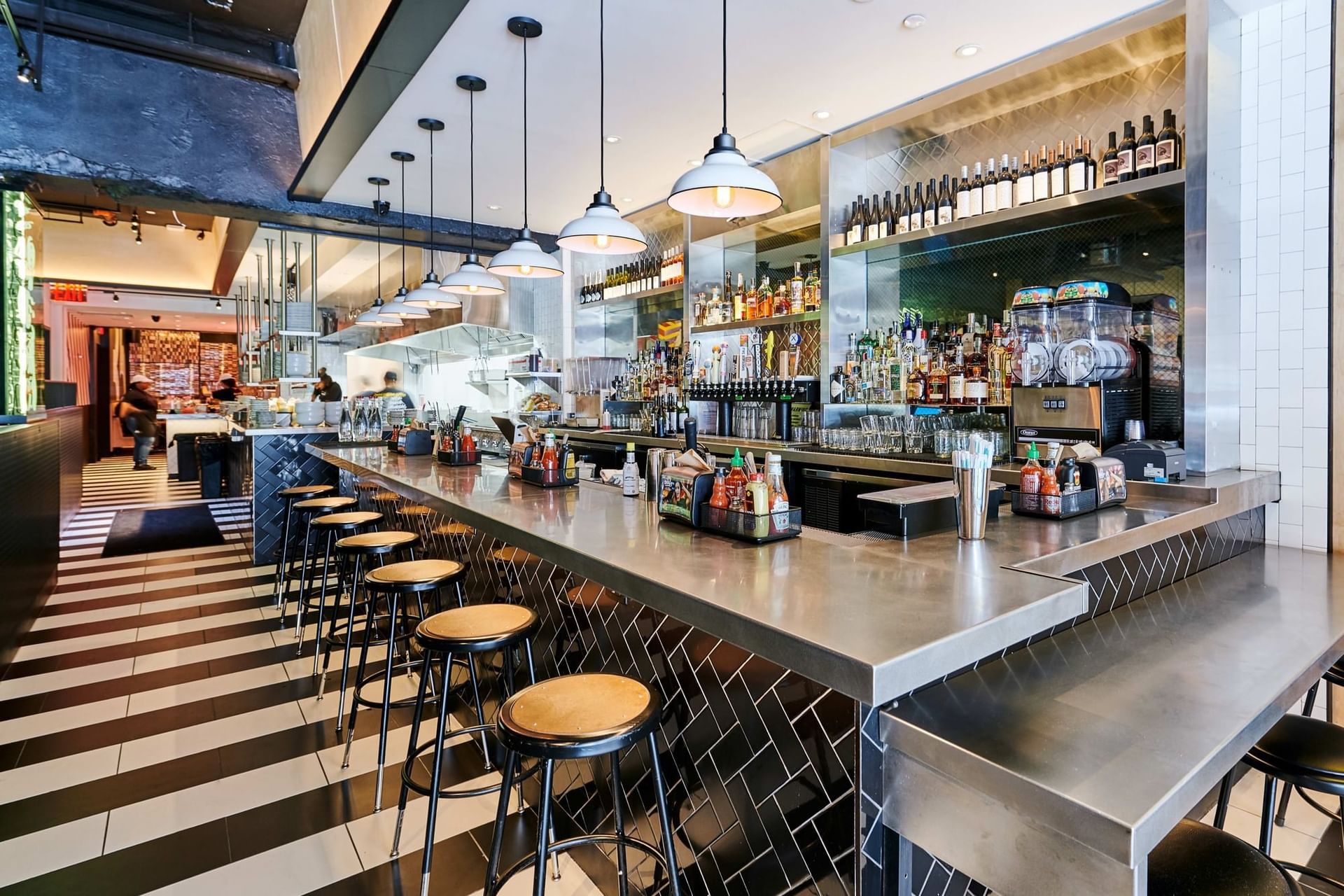 a bar with stools and a counter