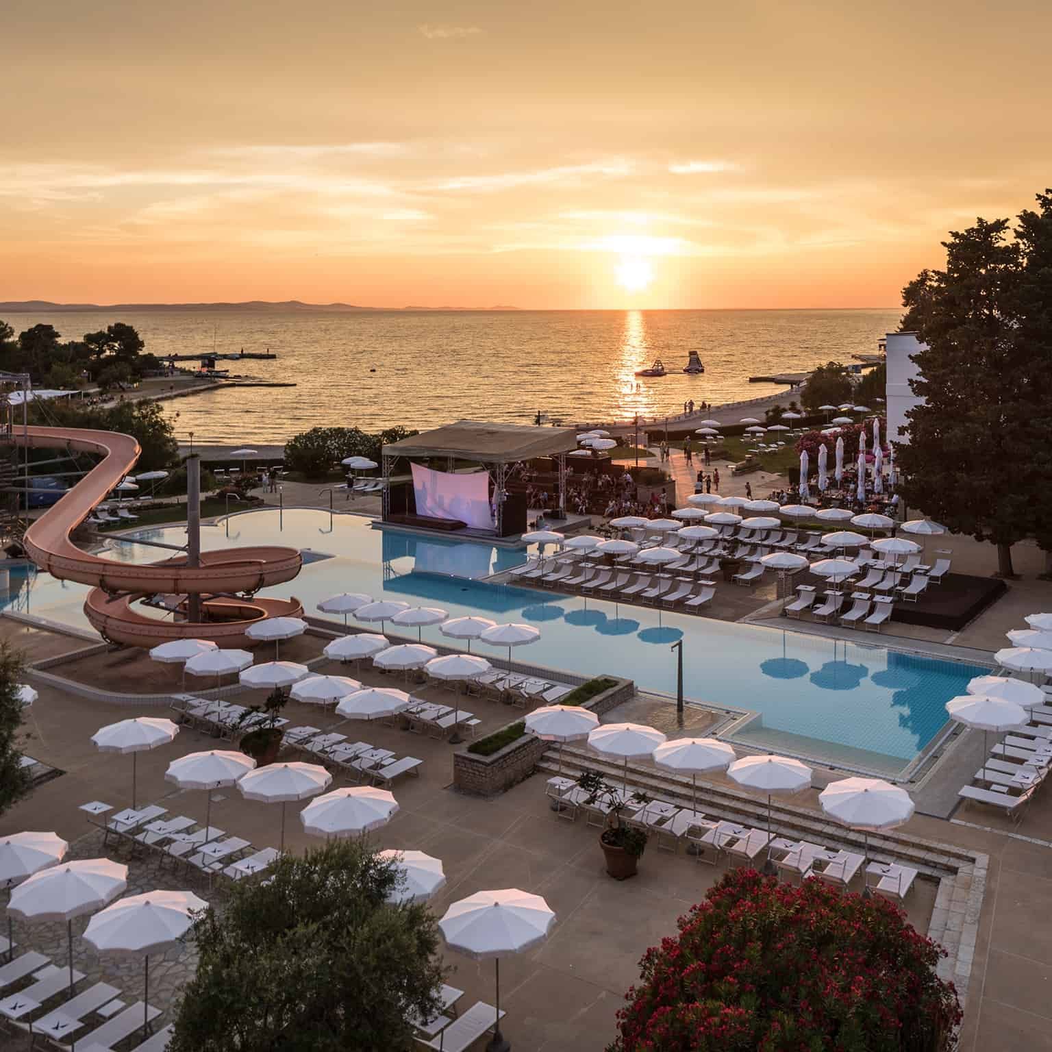 Outdoor Pool & nearby sea at sunset, Falkensteiner Hotels
