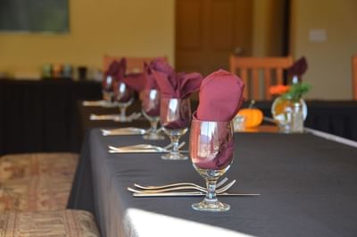 Wine glass with napkin on a black tablecloth in The Shuswap at Hilltop Inn Salmon Arm