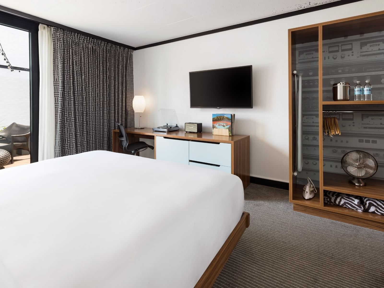 Workspace with TV by the bed in Accessible King - Roll-in-shower at The Verb Hotel