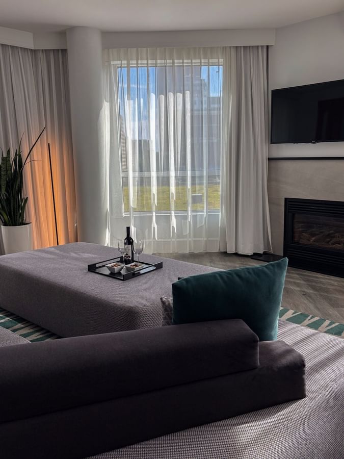 Warwick Premier Suite featuring a cozy living area with a sofa at Warwick Le Crystal Montreal