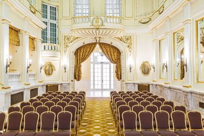 Meeting Room with gold-trimmed walls and theater set-up at Polonia Palace Hotel