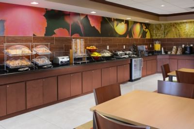 open café with continental breakfast on shelves