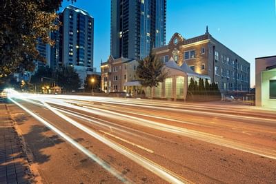 View of the Artmore Hotel from across a street at night