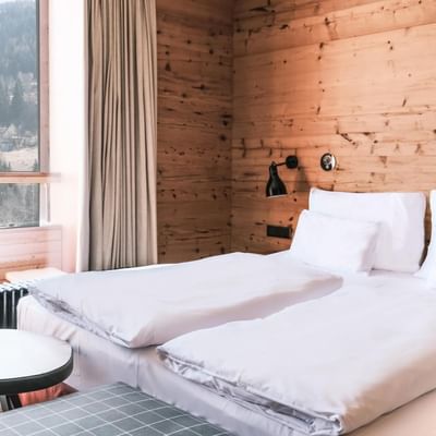 Large bed & mountain view Superior Room at Falkensteiner Hotels