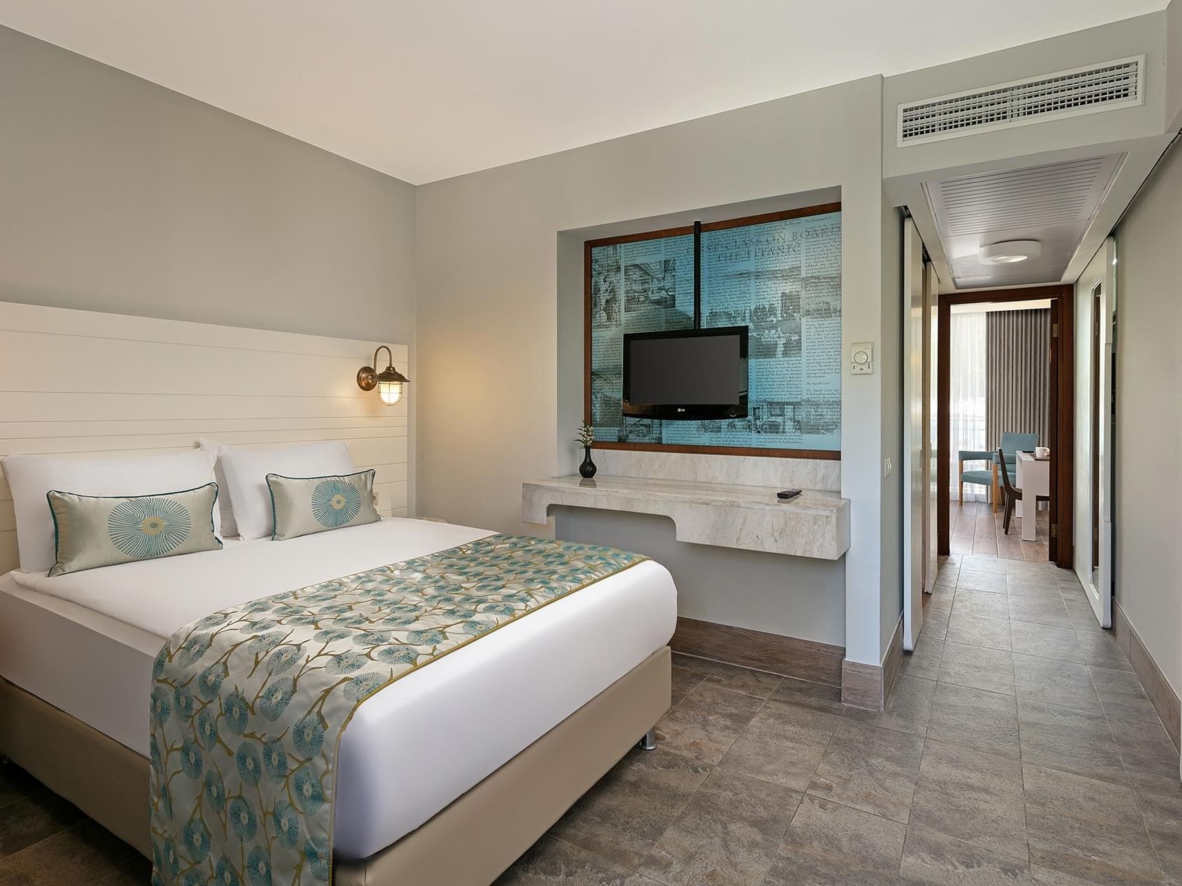 French bed, workspace, and TV in Annex Family Room at Titanic Deluxe Lara