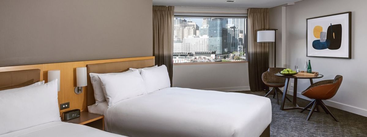 Two double beds with darling harbour view in Executive Room at Novotel Sydney on Darling Harbour