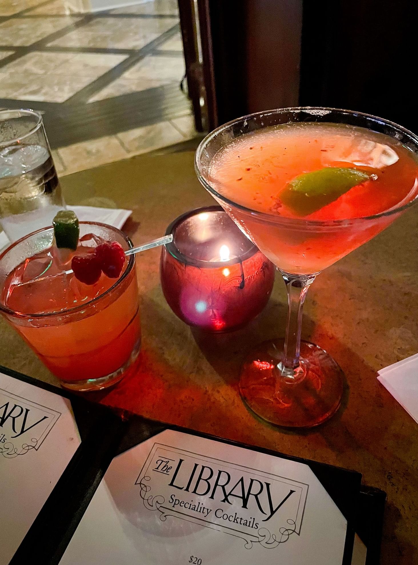 Two colorful cocktails served in The Library Bar at Warwick Melrose - Dallas