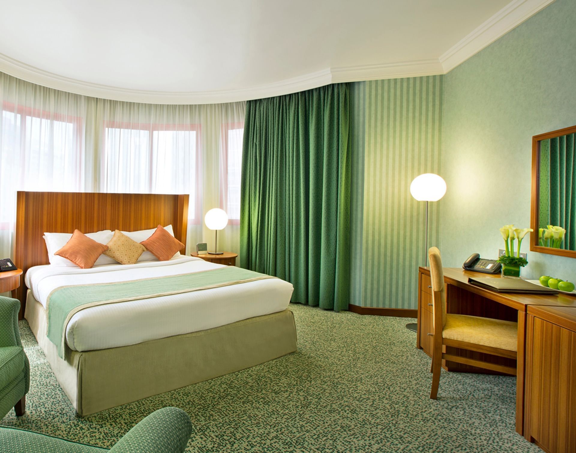 KingBed and furniture in Junior Suite at Al Hamra Abu Dhabi