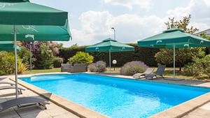 Pool with sun loungers at Hotel du Phare 