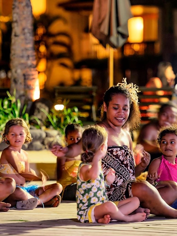 Group of children and adults enjoying an outdoor event in Kids Corner at Warwick Fiji Resort and Spa