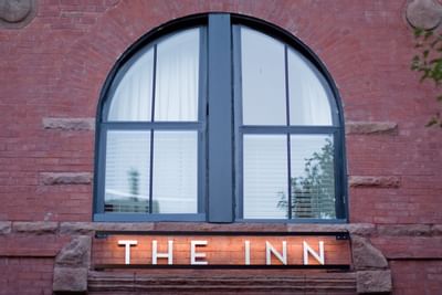 view if the exterior sign saying The Inn